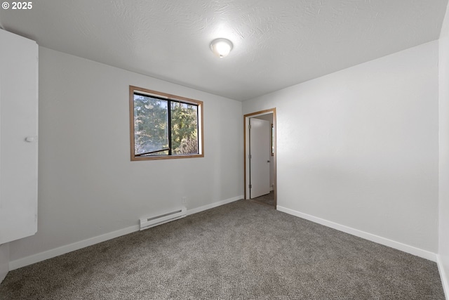 carpeted spare room with baseboard heating and a textured ceiling