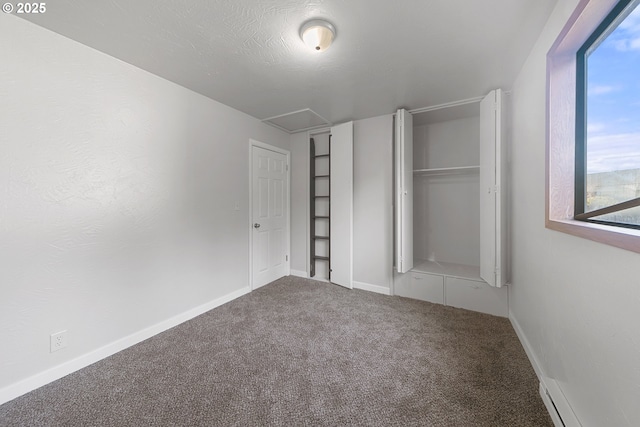 unfurnished bedroom featuring carpet floors, a closet, and a textured ceiling