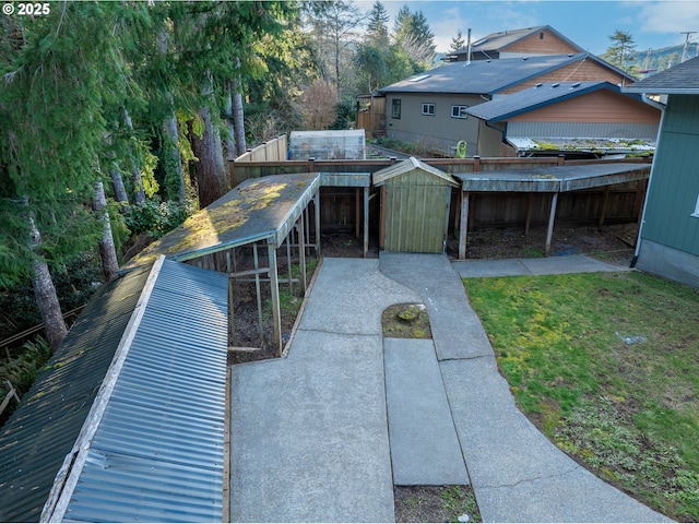 exterior space featuring an outbuilding and a front lawn