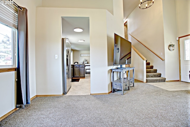 425 Warner St, Oregon City, OR 97045 - foyer with light colored carpet, baseboards, and stairs