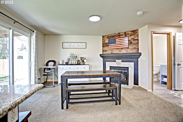 425 Warner St, Oregon City, OR 97045 - carpeted dining room with a fireplace, a textured ceiling, and baseboards