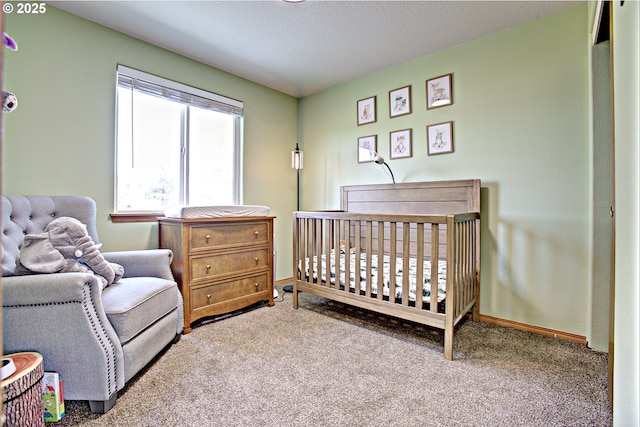 425 Warner St, Oregon City, OR 97045 - carpeted bedroom featuring a crib and baseboards