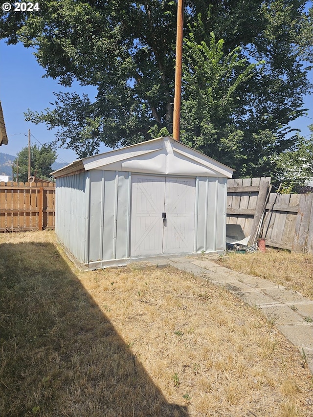 view of shed with fence