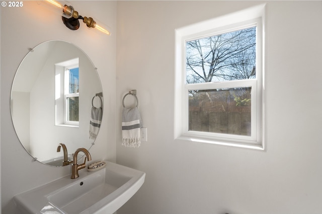 bathroom with a sink and a healthy amount of sunlight