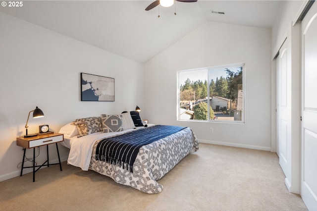 carpeted bedroom featuring lofted ceiling, visible vents, ceiling fan, and baseboards