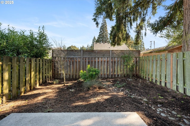 view of yard featuring a fenced backyard