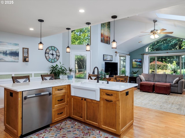 18495 Terry Ave, Lake Oswego, OR 97035 - kitchen with a sink, light countertops, open floor plan, and dishwasher