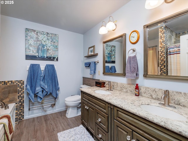 18495 Terry Ave, Lake Oswego, OR 97035 - bathroom with double vanity, a sink, wood finished floors, and toilet