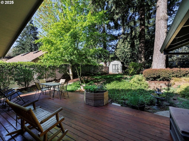18495 Terry Ave, Lake Oswego, OR 97035 - wooden deck with a fenced backyard, a shed, an outbuilding, and outdoor dining space