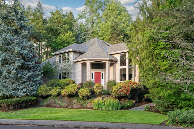 9030 SW Lancelot Ln, Portland, OR 97219 - view of front of property featuring a front yard and a shingled roof