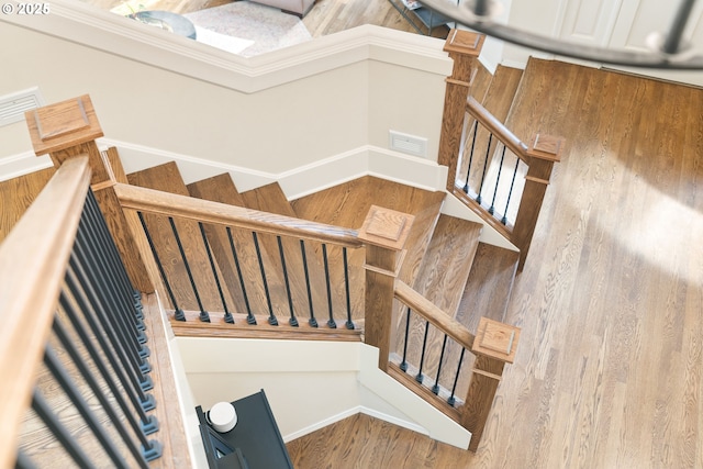 stairway with wood finished floors
