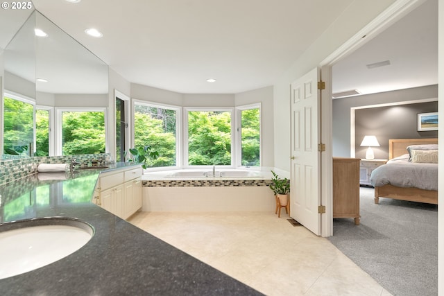 9030 SW Lancelot Ln, Portland, OR 97219 - full bath featuring healthy amount of natural light, vanity, a garden tub, tile patterned floors, and recessed lighting