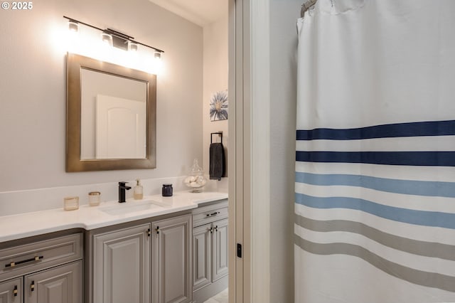 full bathroom with vanity and curtained shower