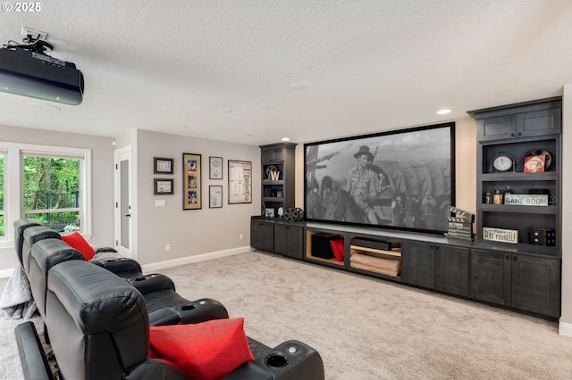 cinema room featuring a textured ceiling, built in shelves, baseboards, carpet flooring, and recessed lighting