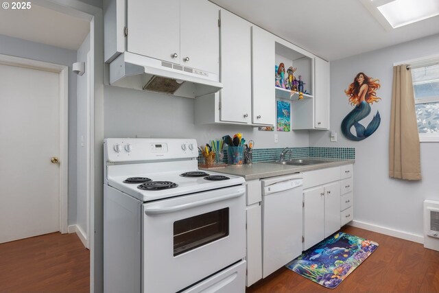 2950 SW Beach Ave, Lincoln City, OR 97367 - kitchen with light countertops, white appliances, dark wood finished floors, under cabinet range hood, and white cabinetry