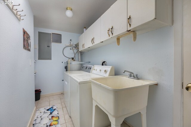 2950 SW Beach Ave, Lincoln City, OR 97367 - laundry room featuring light tile patterned floors, electric panel, a sink, independent washer and dryer, and cabinet space