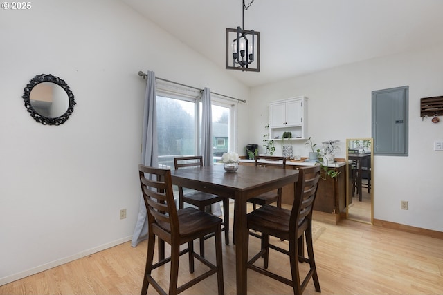 2950 SW Beach Ave, Lincoln City, OR 97367 - dining room with baseboards, light wood finished floors, an inviting chandelier, and electric panel