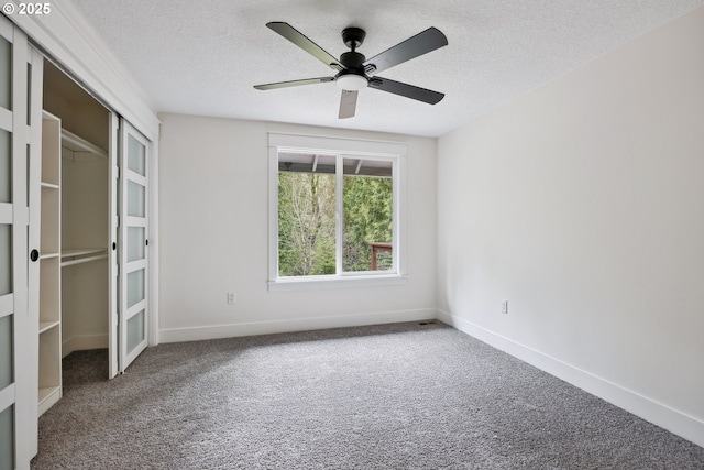 8616 SW 49th Ave, Portland, OR 97219 - unfurnished bedroom with carpet floors, a textured ceiling, baseboards, a closet, and ceiling fan