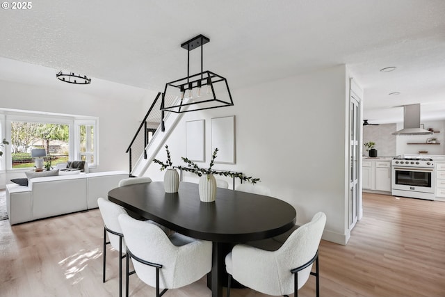 8616 SW 49th Ave, Portland, OR 97219 - dining area featuring stairway and light wood-style floors