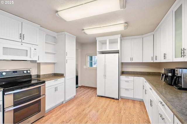 kitchen with white appliances, white cabinetry, open shelves, and light wood finished floors