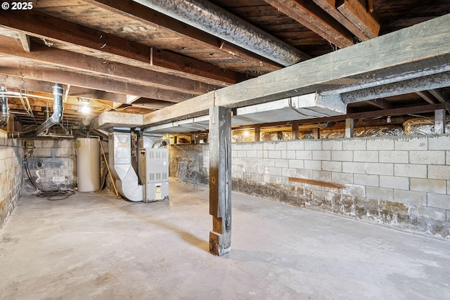 unfinished basement with heating unit and gas water heater