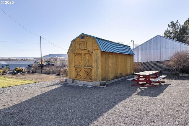 view of shed with fence