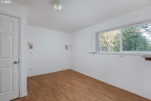 empty room featuring hardwood / wood-style flooring