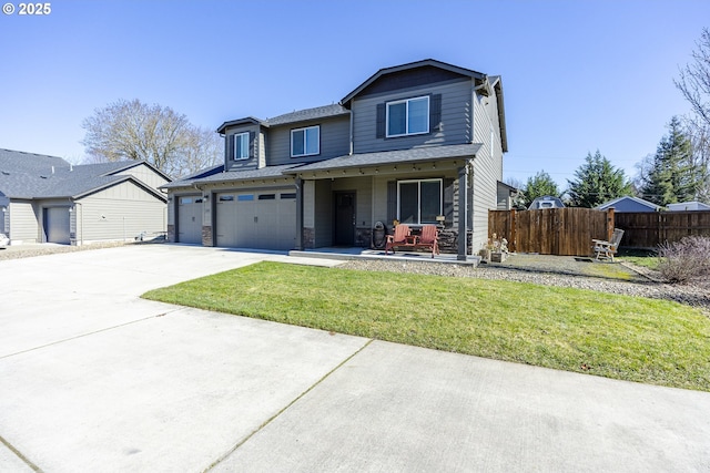 view of front of property featuring concrete driveway, an attached garage, fence, a porch, and a front yard