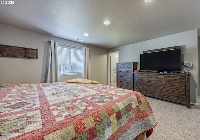 bedroom with recessed lighting, visible vents, a textured ceiling, and light colored carpet