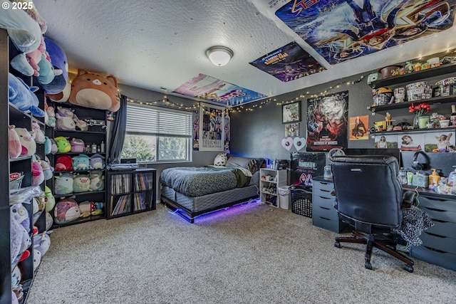 bedroom with carpet floors and a textured ceiling