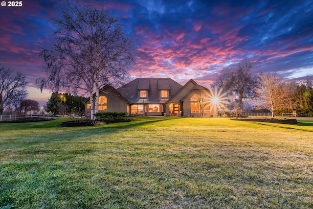 view of front of property with a lawn