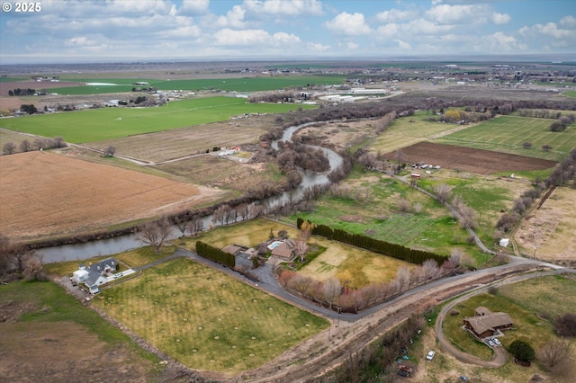birds eye view of property with a water view and a rural view