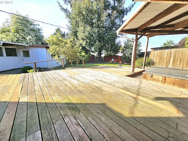 wooden deck with hot tub deck surround and fence
