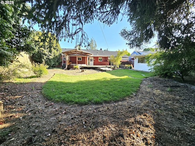 view of yard featuring a wooden deck