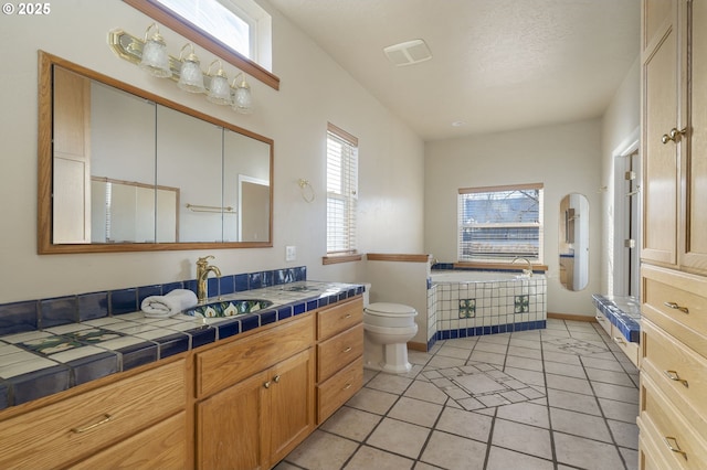 285 W Sunny Sands Rd, Cathlamet, WA 98612 - bathroom featuring healthy amount of natural light, toilet, vanity, and tile patterned flooring