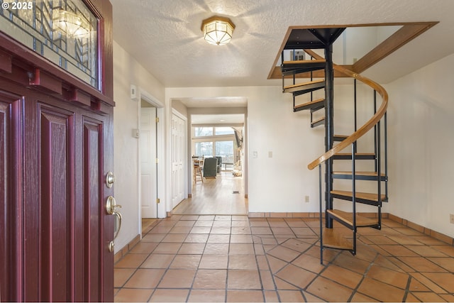 285 W Sunny Sands Rd, Cathlamet, WA 98612 - tiled foyer featuring stairway, baseboards, and a textured ceiling