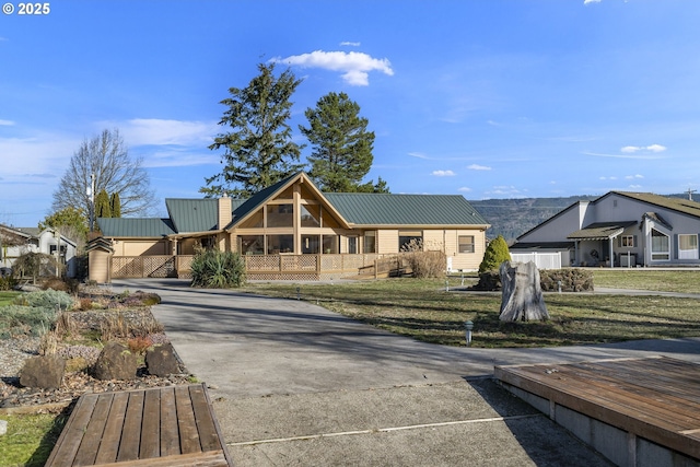285 W Sunny Sands Rd, Cathlamet, WA 98612 - view of front of house with metal roof, a chimney, and a residential view