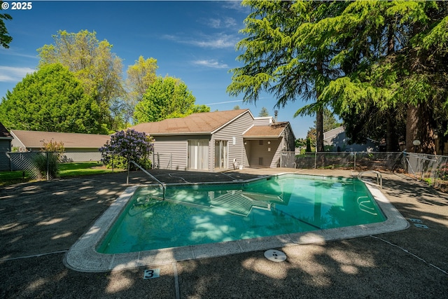 view of pool with fence