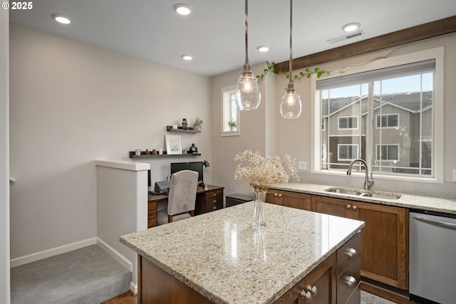 kitchen with brown cabinets, recessed lighting, visible vents, a sink, and dishwasher