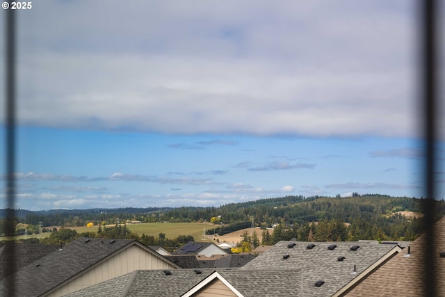 exterior space with a wooded view