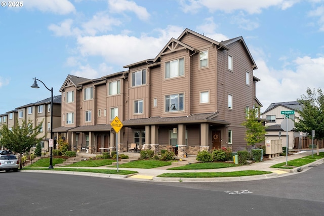 view of property with a residential view and stone siding