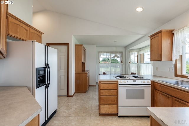 305 Pacific St, Columbia City, OR 97018 - kitchen featuring white appliances, light countertops, brown cabinets, light tile patterned floors, and high vaulted ceiling