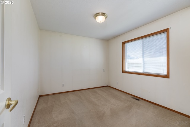 305 Pacific St, Columbia City, OR 97018 - carpeted empty room with baseboards