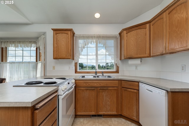 305 Pacific St, Columbia City, OR 97018 - kitchen featuring white appliances, a sink, healthy amount of natural light, light countertops, and recessed lighting
