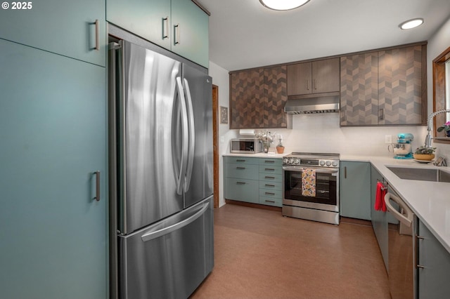 3511 NE Holman St, Portland, OR 97211 - kitchen with stainless steel appliances, extractor fan, light countertops, and tasteful backsplash