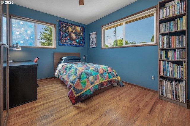 3511 NE Holman St, Portland, OR 97211 - bedroom featuring wood finished floors and ceiling fan