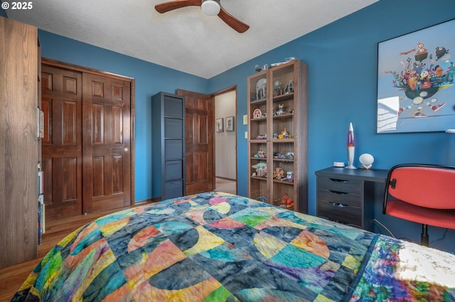 3511 NE Holman St, Portland, OR 97211 - bedroom with a closet, wood finished floors, and a ceiling fan