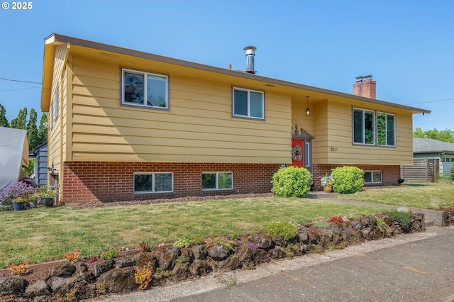 3511 NE Holman St, Portland, OR 97211 - raised ranch featuring a chimney and a front lawn