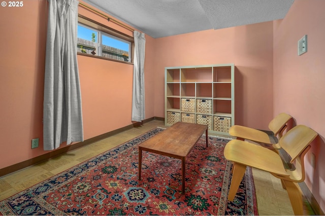 3511 NE Holman St, Portland, OR 97211 - sitting room featuring a textured ceiling and baseboards