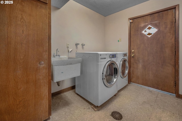 3511 NE Holman St, Portland, OR 97211 - washroom with independent washer and dryer and a textured ceiling